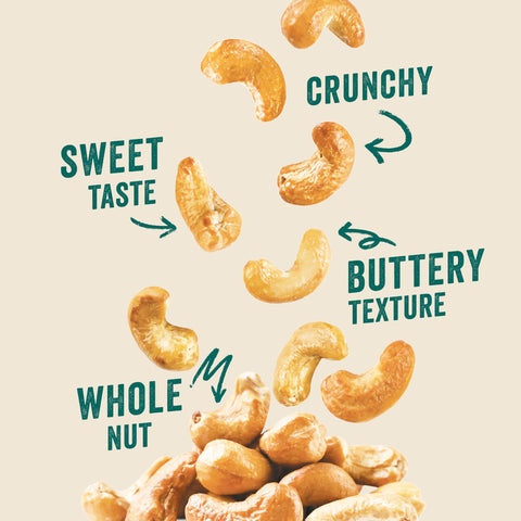 Go Nuts cashews scattered on rustic wood surface